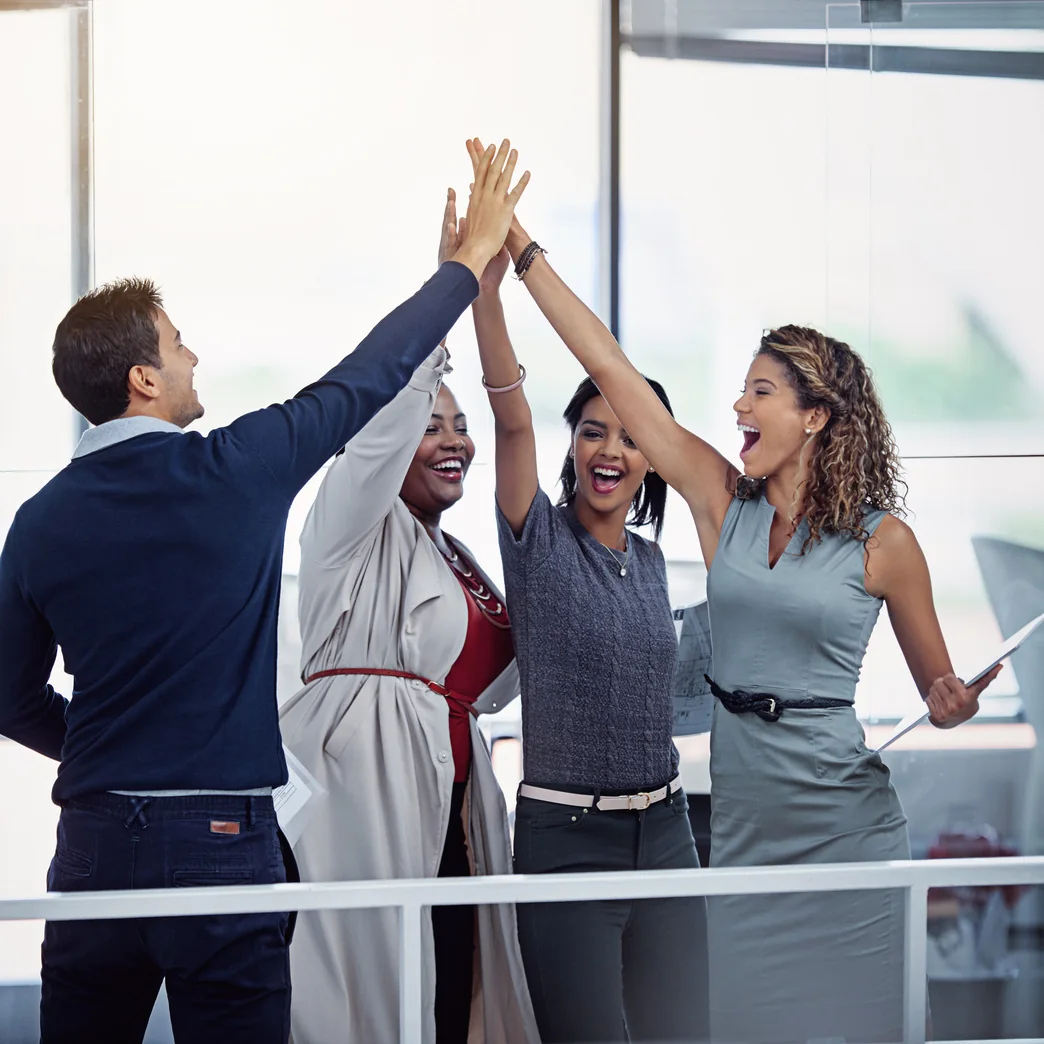 Professional team celebrating successful delivery together